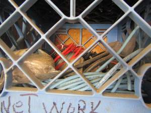 lot 282 image: 6 crates  with wiring, lights, phone, toy parts