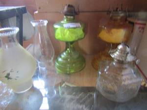 lot 311 image: vintage oil lamps - Emerald green base,  Amber base and clear glass base. 2 chimneys
