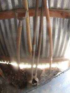 lot 374 image: yard tools rakes, shovels, and post hole diggers