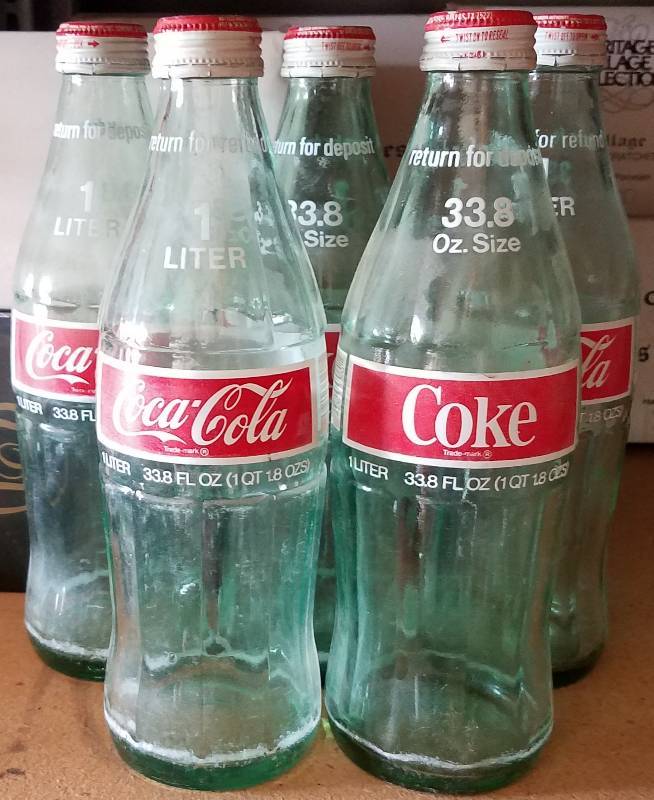 lot 129 image: VINTAGE COCA-COLA 1 LITER GLASS BOTTLES