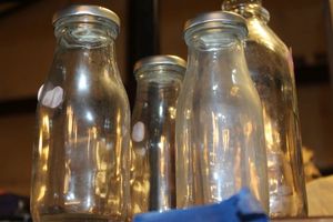 lot 222 image: Vintage Glass Milk Containers&nbsp