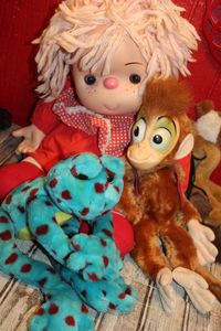 lot 92 image: Doll and Stuffed Animals as Shown