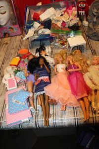 lot 98 image: Selection of Barbie Dolls, Clothes, and Accessories&nbsp