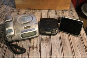 lot 65 image: Telephone CD Stereo Alarm clock combo, Portable CD Player and Projection Clock