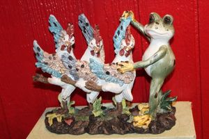 lot 74 image: Dancing Frog and Figurines