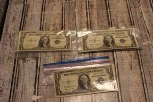 lot 76 image: Three One Dollar Silver Note Bills..1936G with no motto