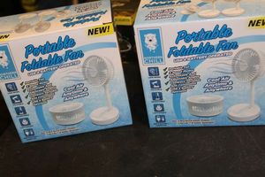 lot 284 image: Two Portable Foldable Fans.. Unused