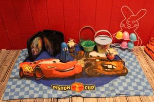 lot 253 image: Childs Easter Deco items, DVD Selections in a cace and more as seen