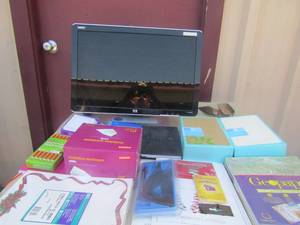 lot 31 image: hp computer with plug with various office supplies, pens, notebooks, envelopes, and more (helton)