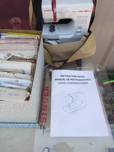 lot 34 image: janome sewing machine with various simplicity patterns (helton)