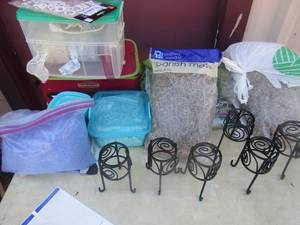 lot 48 image: Spanish moss qty 5, Rubbermaid ribbon holder with various ribbon, hot glue gun, purple sand in a box, blue rocks and more