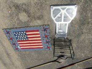 lot 62 image: 3 tier black counter top shelf, New rolling grocery cart basket, American flag entry rug