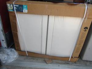lot 81 image: Diamond now 36 wide 3 ft. tall white dB door cabinets New in box, may have minor damage from sitting in storage