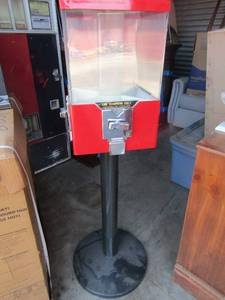 lot 84 image: Red 4 sided candy vending machine on stand