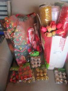 lot 95 image: Christmas gift bags, ribbon and wrap, various color bells new in pack, some packaging has damage