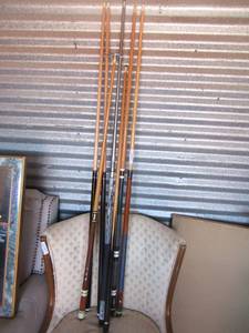 lot 116 image: Various styles of pool sticks qty 7, one helps with aiming and shooting, like a guide stick