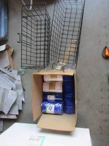 lot 128 image: 2 black metal baskets, also various rolls of decorative mess blue and white