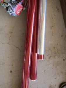lot 183 image: GIFT  BASKET WRAP - box of 1 roll of clear wrap and 3 rolls of red wrap all new  - f(ST)
