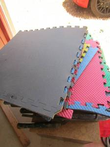 lot 197 image: rubber color mats was used on floor of work shop, can be used in kids playroom- patio are more ( Springtown)