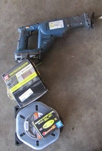 lot 161 image: DeWalt 300 ft. tape measure, weed eater string, ryobi 18v skil saw with battery, construction screws