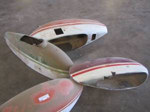 lot 188 image: 4 airplane wheel covers 2 orange, 1 red, and 1 green