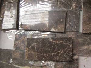 lot 62 image: MARBLE WALL TILE BOX IS OPENED