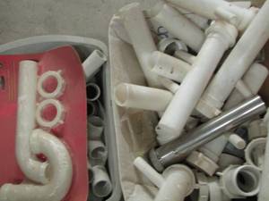 lot 97 image: KNEE PADS AND PVC PIPING ENDS AND ELBOWS