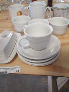lot 141 image: 2 wooden spools- Fiesta dishware and a few coffee cups