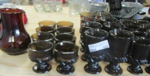 lot 163 image: Sorrento brown wine glass 5in qty 8, Sorrento brown champagne sherbet dish 3 in qty 8, Sorrento tall wine glasses qty 8 and 1 brown pitcher