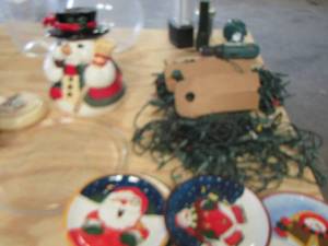 lot 168 image: Christmas lot includes 4 royal Norfolk Santa and snowman saucers, 1 glass platter, covered dish, snowman cookie jar with 2 strands of Christmas lights