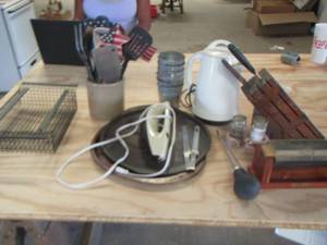 lot 169 image: kitchen lot includes mini metal buckets, kitchen utensils, pizza pans knife sharpener, knifes and more