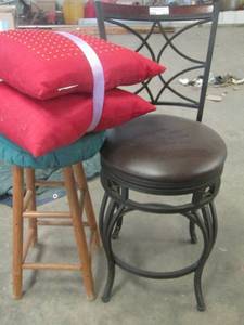 lot 214 image: 2 red beaded pillows, 1 bar stool, 1 stool with no back wooden