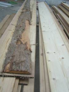 lot 229 image: CEDAR  piece of wood ,10 ft. long and misc. pieces of 8 to 12 ft. long