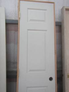lot 248 image: 83X22 FRAMED SINGLE DOOR WITH A HOLE CUT FOR DOOR KNOB QUANTITY TWO NEW IN GOOD CONDTION