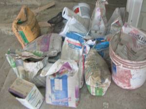 lot 250 image: LARGE LOT OF CEMENT, GROUT SANDED AND NON - SANDED, ALL HAVE BEEN PARTIALLY USED SOME IN BAGS , SOME IN BOXES