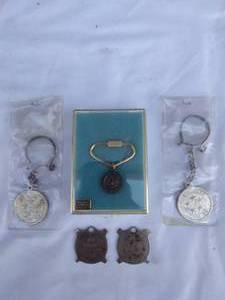 lot 150 image: Nice Selection of Keychain Pendants Including 2 U.S. Army Reserve, 2 U.S.S. Nimitz and 1 Seal of Texas