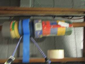 lot 58 image: RACK HOLDING ALL YOUR TAPE ROLLS NEW AND USED DUCK TAPE AND PAINTERS TAPE