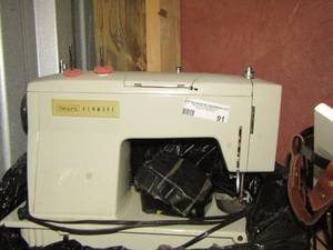 lot 91 image: Sears Kenmore sewing machine with foot pedestal