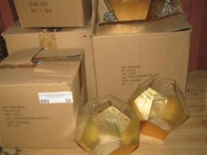 lot 95 image: 4 boxes of home dcor or can be used for table dcor at parties