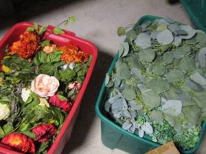 lot 109 image: 2 tubs full of wax floral dcor all appears slightly used