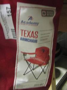 lot 157 image: Texas folding chair in bag red in color