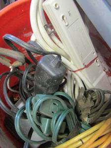 lot 169 image: orange bucket full of smaller house hold extension cords