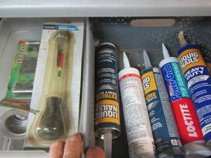 lot 187 image: Caulking - tire repair kit- battery tester