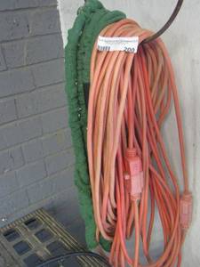 lot 200 image: Expandable water hose- orange outdoor extension cord