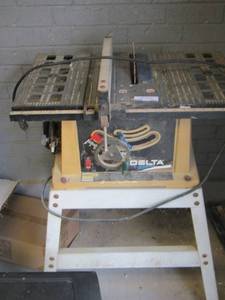 lot 201 image: Delta table saw on stand