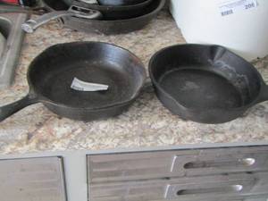 lot 209 image: Cast iron skillets  QTY 2 ,   1 is by Wagner