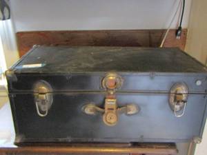 lot 254 image: black chest with a handheld sewing machine, fiber fill, various other sewing material