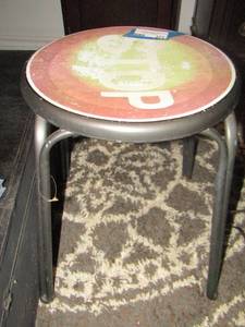 lot 271 image: small metal stool that has the word stop imprinted on it