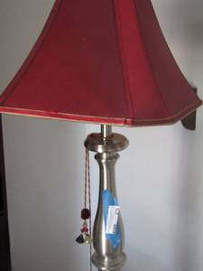 lot 279 image: 5 ft. silver floor lamp with a red shade