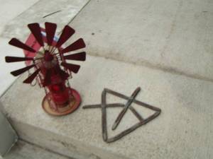 lot 293 image: 20 in tall red metal windmill bird feeder and crosses made of horse shoes